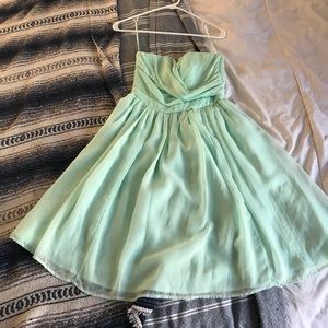 Knee length strapless teal dress